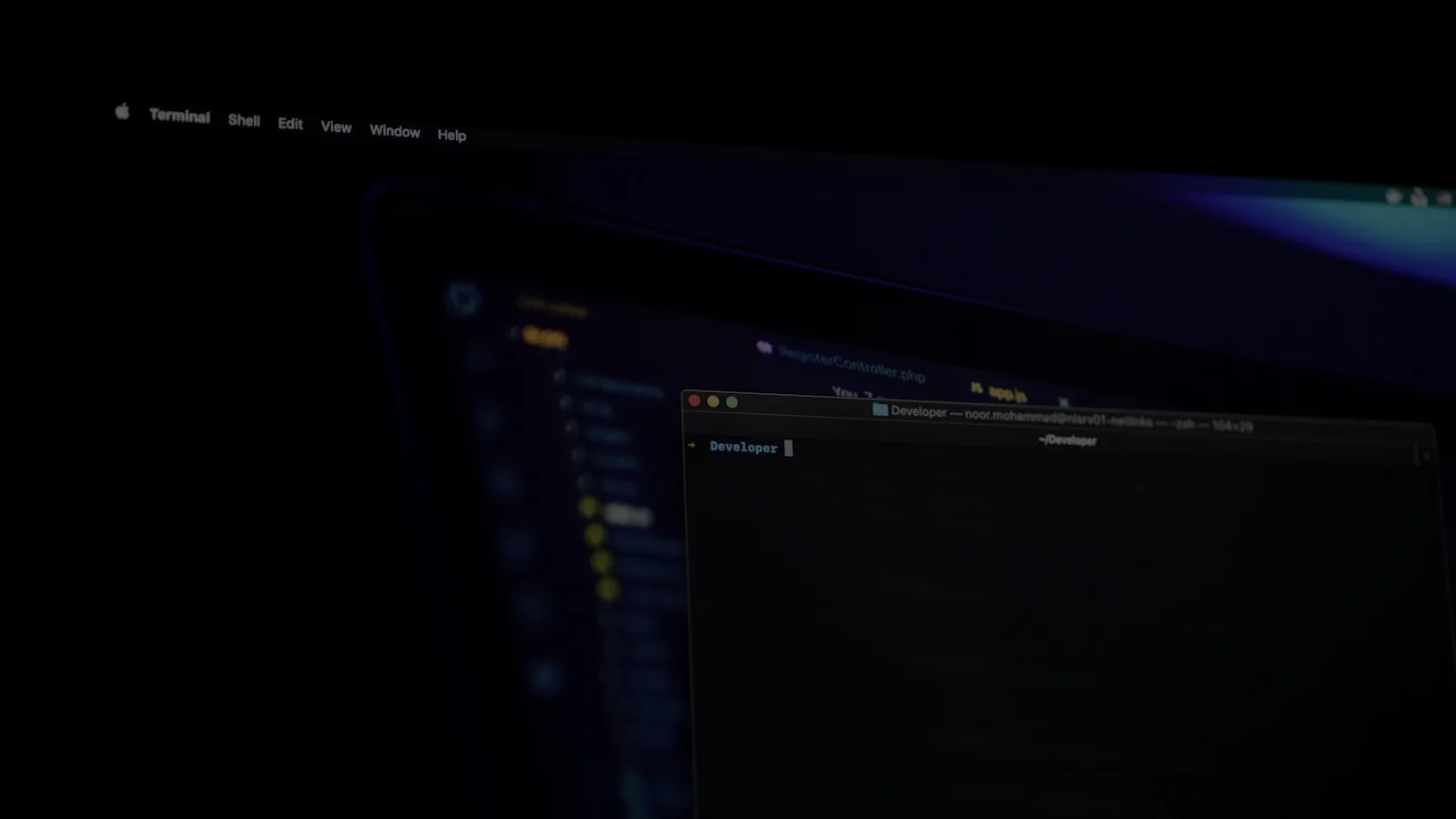 Code displayed on a monitor in a dim room